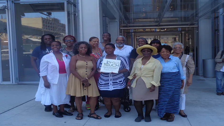 Cohort 9 of the Columbia Wellness Center's Community Health Worker training program post outside of the center to take a picture. 